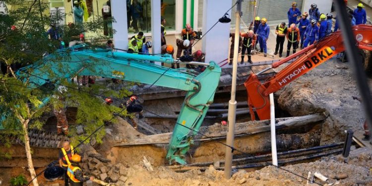 Malaysia halts rescue operation for woman who plunged into sinkhole