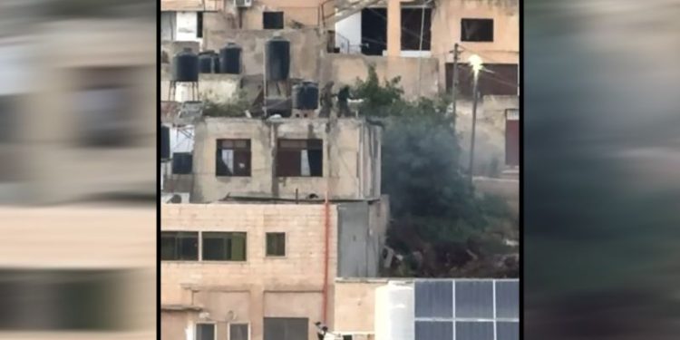 IDF investigating soldiers for throwing bodies off roof in West Bank