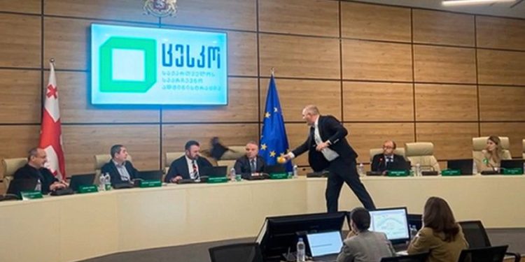 Georgia election chief doused in paint as protests continue after divisive parliamentary vote