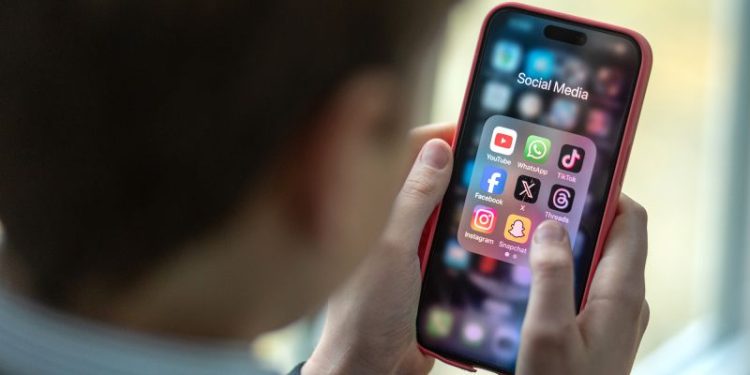 Australia tables bill to limit under-16s from using social media with tech companies facing huge fines