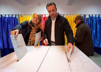 Romanians vote in parliamentary election amid turmoil over claims of Russian interference in presidential race