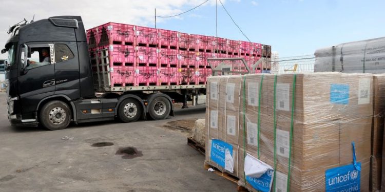 Israeli strikes kill at least 200 in Gaza as UN halts aid deliveries after more trucks stolen