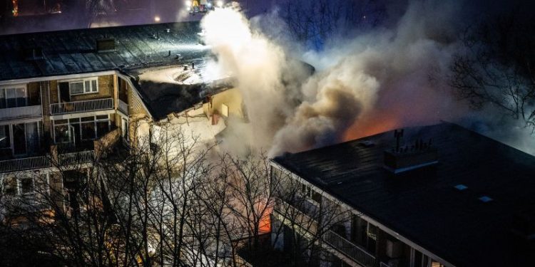 At least four in hospital after blast causes Dutch apartment building to partially collapse