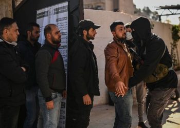 Former Assad security forces hand in weapons to new Syrian government