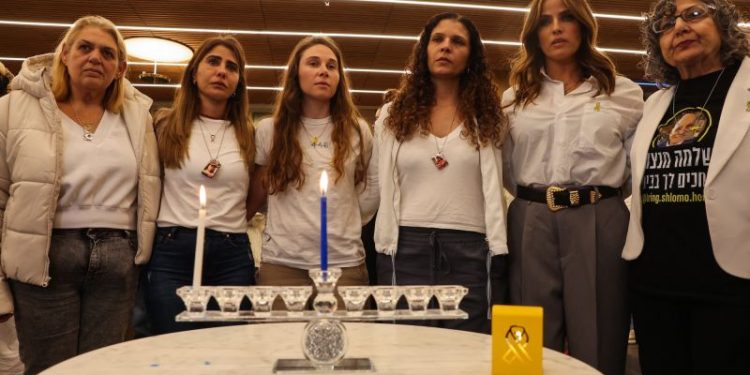 Israeli hostage families light first candle of Hanukkah, marking start of second holiday without loved ones
