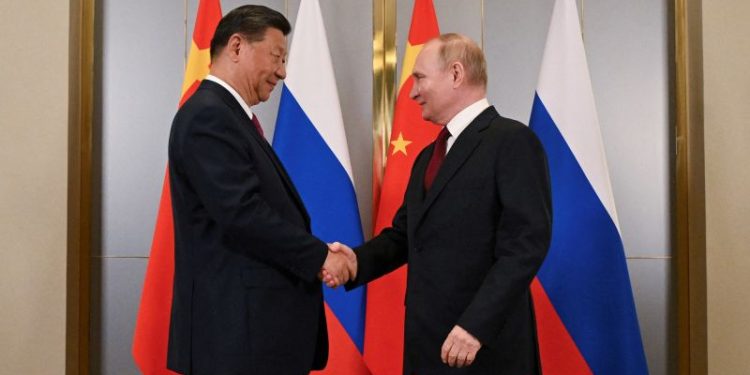 Xi and Putin hail tightening ties in call hours after Trump inauguration