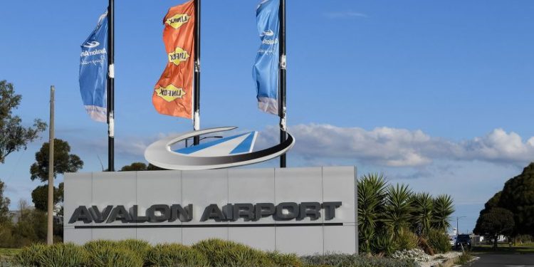 A boy with a loaded shotgun boarded a plane in Australia but was tackled by a former boxer